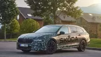 22_Covered_Skoda_Superb
